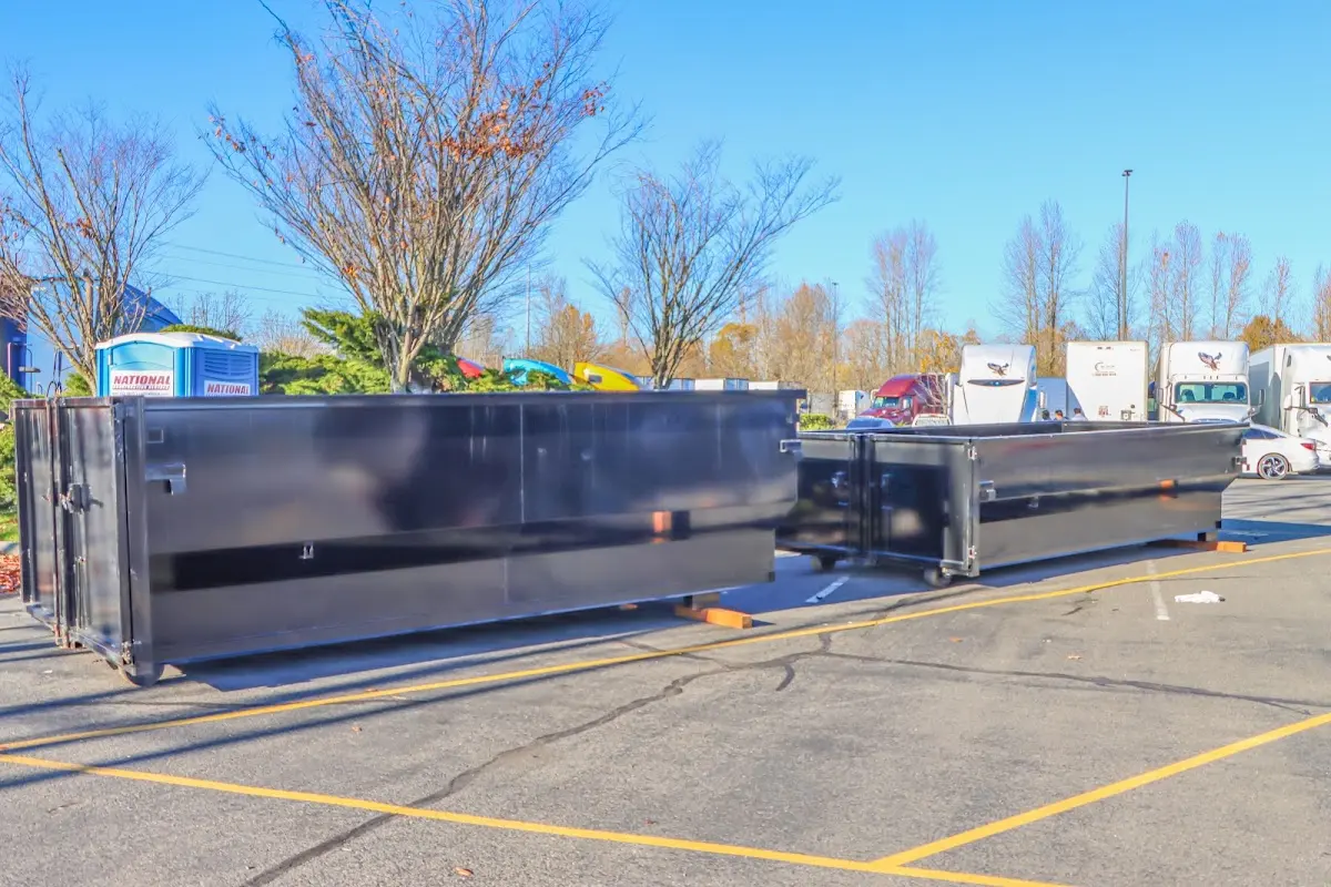 Professional dumpster rental service with roll-off container on residential driveway in Rossmoor